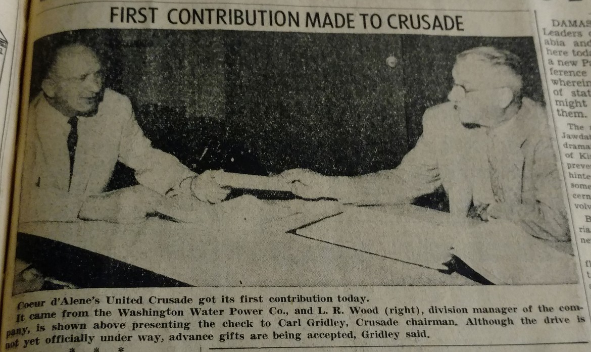 Archive photo
&#147;Coeur d&#146;Alene&#146;s United Crusade got its first contribution today,&#148; reads the caption of this Sept. 26, 1957 Press photo. Washington Water Power division manager L.R. Wood, right, presented the contribution to Crusade chair Carl Gridley before the drive officially began.