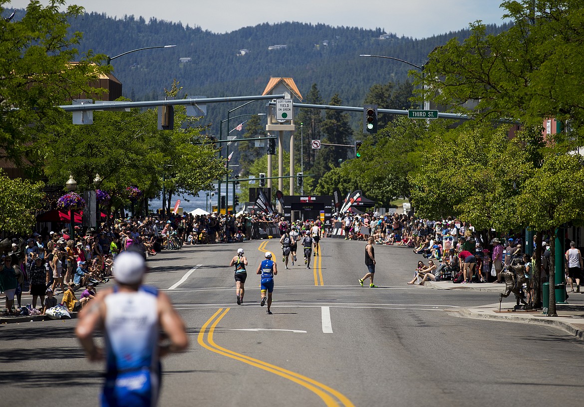 LOREN BENOIT/Press

Athletes near the Ironman 70.3 Coeur d&#146;Alene finish line on Sherman Avenue Sunday afternoon in downtown Coeur d&#146;Alene.