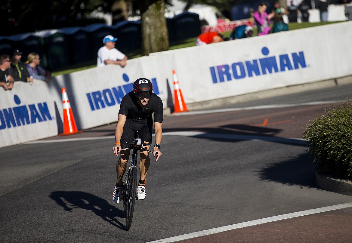 LOREN BENOIT/Press

Christopher Carpenter rounds the turn onto Lakeside Avenue at the beginning of the bike leg during Coeur d&#146;Alene Ironman 70.3.