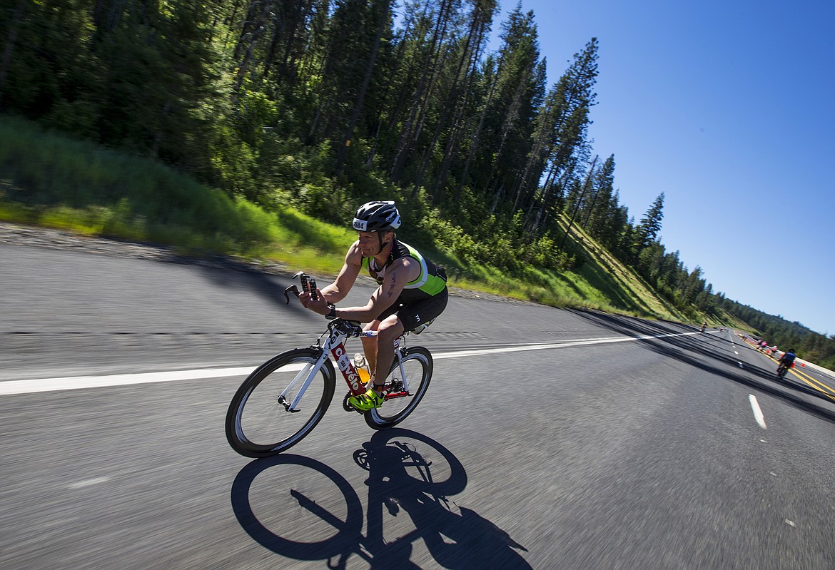 LOREN BENOIT/Press

Scott Gende cruises down Mica Grade during the bike leg portion of Ironman Coeur d&#146;Alene 70.3 on Sunday. Gende finished 284th overall with a bike time of 2 hours, 48 minutes and 39 seconds.