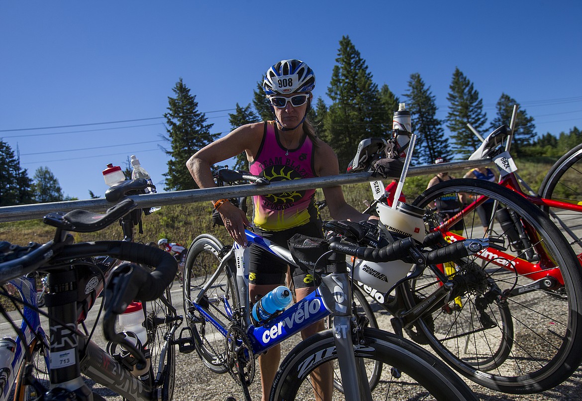 LOREN BENOIT/Press

Beth Giffing takes her bike of a rack after taking a bathroom break during Ironman 70.3 Coeur d&#146;Alene.