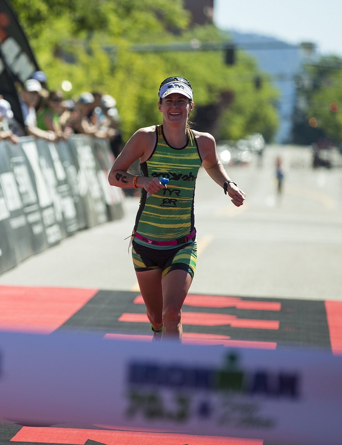 LOREN BENOIT/Press

Haley Chura, 32, of Bozeman, Montana nears the Ironman Coeur d&#146;Alene finish line tape. Chura finished the 70.3 mile race with a time of four hours, 27 minutes and 16 seconds, marking her as the fastest female in the race.