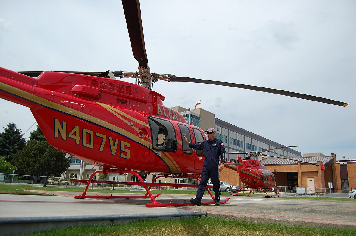 ALERT pilot Matthew Weller stands next to the nonprofit&#146;s new helicopter air ambulance, a Bell 407 GXP. (Katheryn Houghton/Daily Inter Lake)