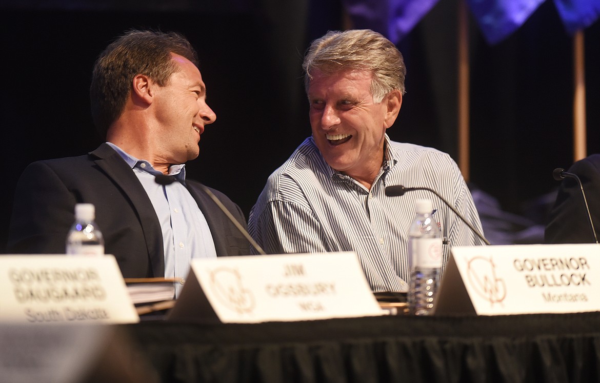 Governor Steve Bullock shares a laugh with Governor C. L. &#147;Butch&#148; Otter of Idaho at the start of the Western Governors Association 2017 Annual Meeting on Monday, June 26, at the Whitefish Performing Arts Center. (Brenda Ahearn/Daily Inter Lake)