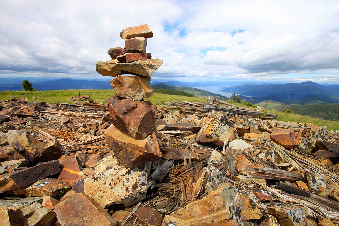 A cairn made by hikers on the north summit of Chilco Mountain with views of Lake Pend Oreille.