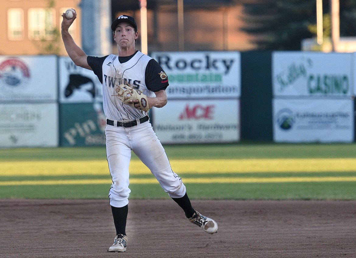 Glacier Twin second baseman Thomas Hellwig throws to first for an out during the top of the second inning against the Calgary Redbirds. (Aaric Bryan/Daily Inter Lake)