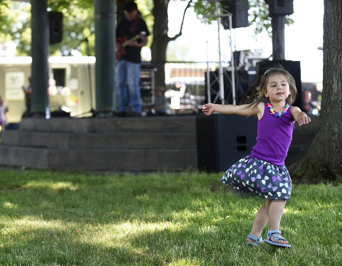 KYMBER MANTEL dances while Ron Sanders play during Picnic in the Park at Depot Park. (Aaric Bryan/Daily Inter Lake)