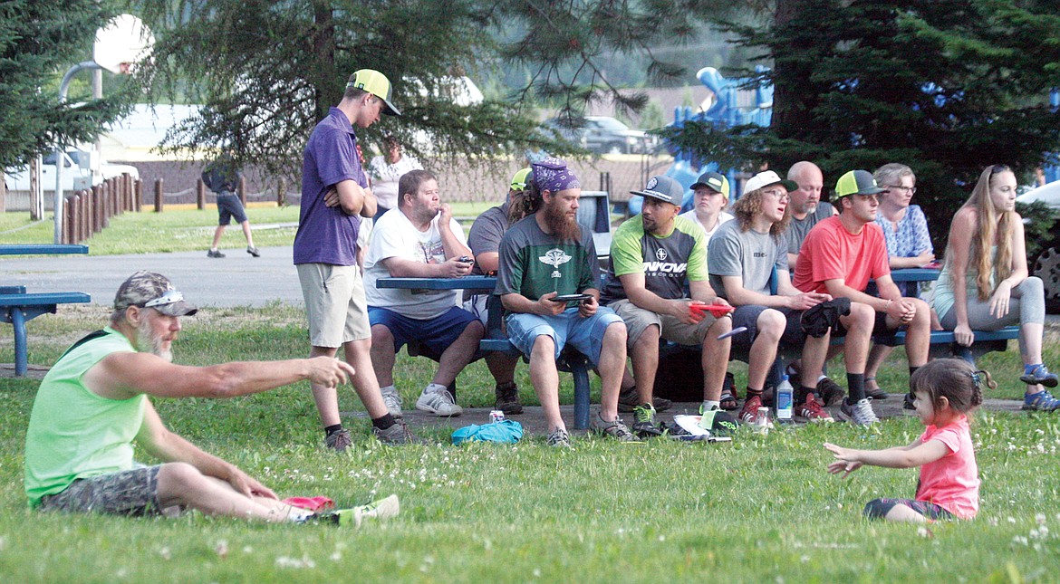 Mike Wallis, caretaker of the disc golf course in Troy, plays catch during the Timberbeast 2017 awards ceremony. (Elka Wood/The Western News)