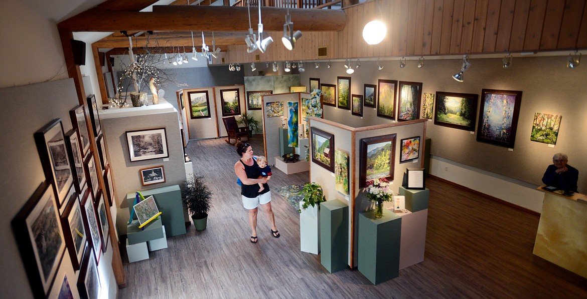 BETH WOODS of Bigfork and her son Brian, 1, visit the Bigfork Art and Cultural Center in this file photo. (Brenda Ahearn/Daily Inter Lake, file)