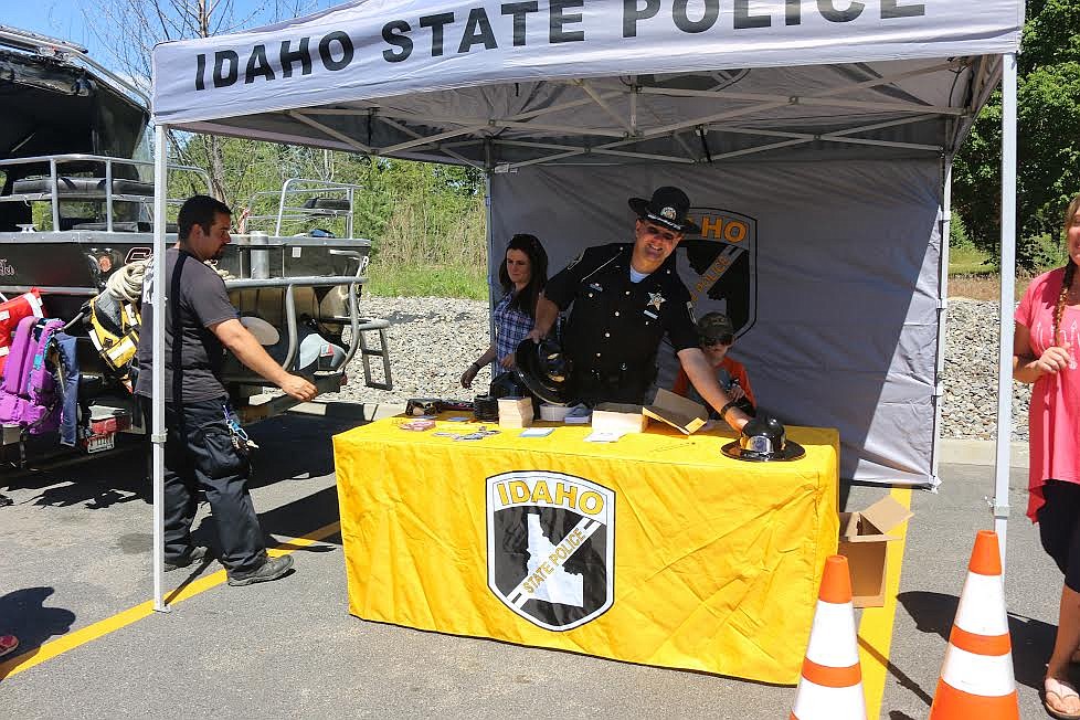 Photo by Mandi Bateman
Idaho State Police Trooper Dustin Kralik, handed out trooper hats to the kids and information to the adults.