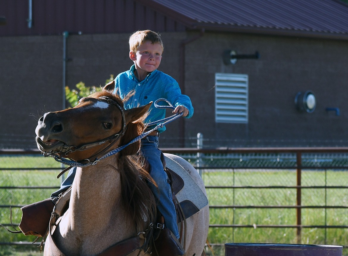 SETH SINCLAIR is determined to get around the barrel without tipping it over. (Marla Hall/Lake County Leader)