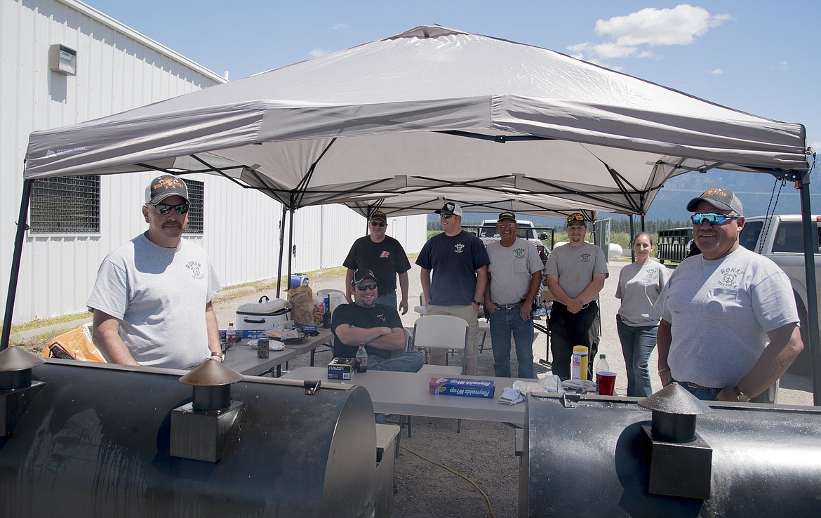 MEMBERS of the Ronan Volunteer Fire Department man the grills Saturday as the group, along with Harvest Foods, hosted their annual &#147;Tri-Tips Dinner.&#148; (Marla Hall/Lake County Leader)