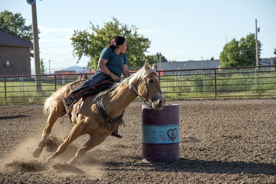 This competitor on her beautifully athletic Palomino looks to barrel 3 as the duo rounds barrel two.  After putting in the leading time, she was off to Polson to rope in the ladies break-away event.