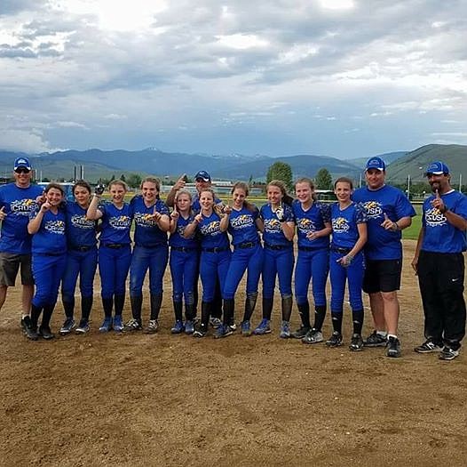 Courtesy photo
The Coeur d&#146;Alene Crush &#146;04 won the 12-and-under championship at the recent &#147;Zootown&#148; softball tournament in Missoula. The Crush won all 4 of their pool play games to make the Gold Bracket. The most exciting pool play game was against the Belgrade Wolfpack &#151; the Crush was down 7-0 in the fourth inning, and came back in the bottom of the last inning that time allotted on a go-ahead two-run triple by Brynn Tolzmann for the 8-7 win. In Gold Bracket play, the Crush beat the Helena Blue Thunder 12-2, sparked by Matea Dorame&#146;s two-run over-the-fence homer. The Crush then beat the Spokane Stealth 15-2 to advance to the championship g;ame. In the title game, the Crush led the Kalispell Regulators from Canada 6-1 prior to a lightning delay. After play resumed, the Crush pulled away for a 29-3 victory. Pictured from right are coach Mike Dorame, coach Robert Schmidt, Brooklyn Wullenwaber, Brynn Tolzmann, Alexis Blankenship, Kaylyn Rice, Ally Bell, coach Sean Cleave, Madi Cleave, Matea Dorame, Kristine Schmidt, Alyssa Krause, Catherine Bakken and coach Tim Rice.