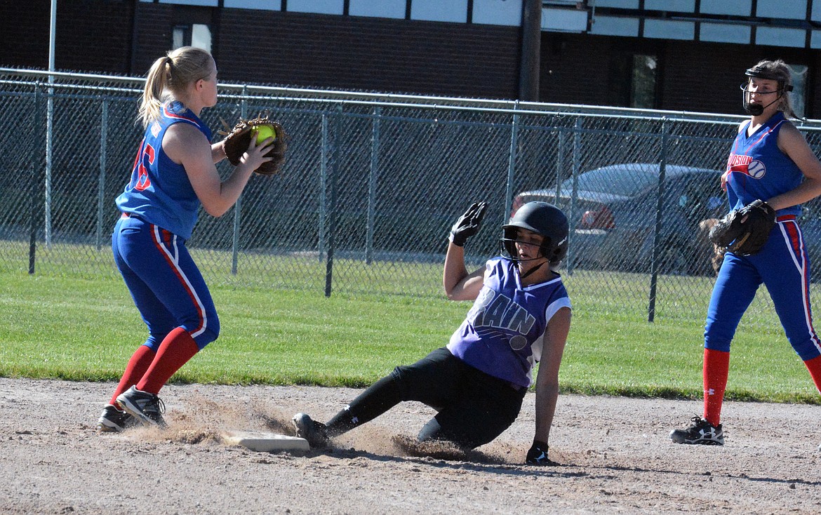 PAIGE NOYES slides into the second base during a championship game against Great Falls in the Splash Tournament. (Jason Blasco/Lake County Leader)