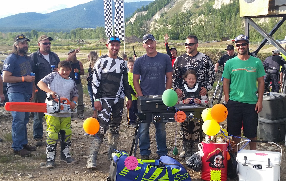 The raffle winners at the MotoX event held on Saturday, June 17 in Libby. Donors included NW Motorsports (chainsaw), Dream Marine (gearbag) Ace Hardware (grill), High Spirits Liquor (Captain Cooler), Les Schwab Tires (Yeti Cooler). (Courtesy Photo)