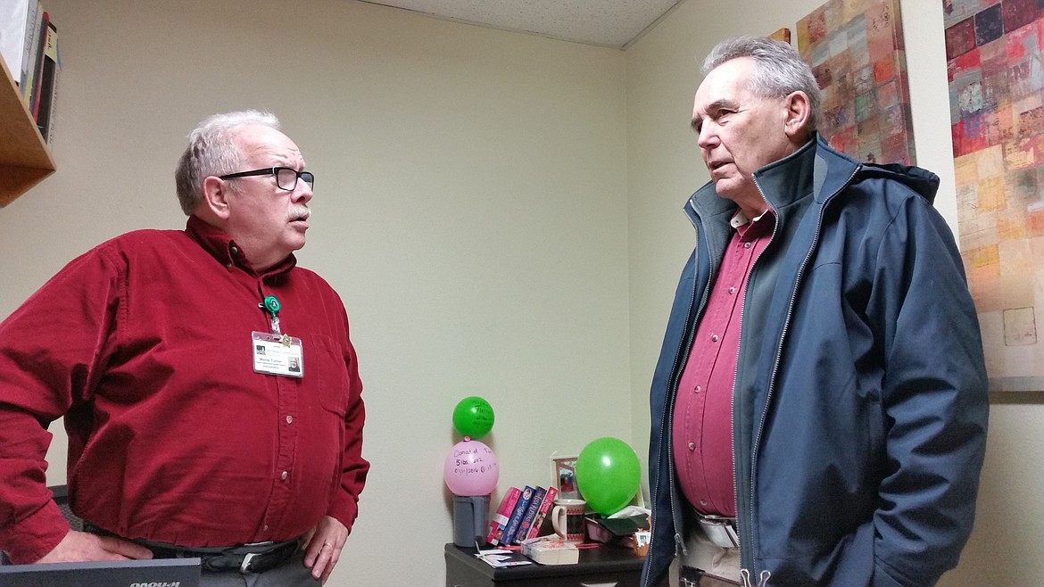 Monte Turner, left, talks to George Gupton, who is retiring from his job as the Mineral County Disaster Emergency Services Coordinato after 18 years.