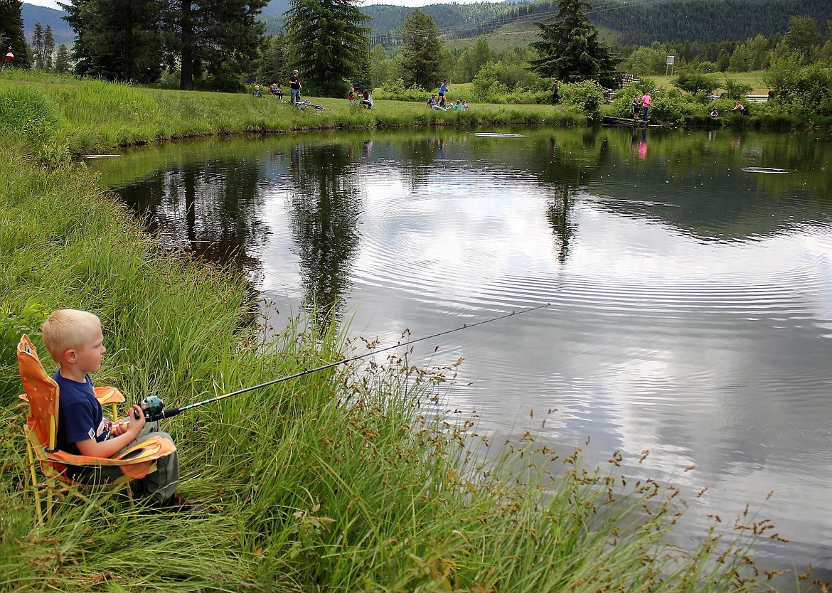 DOMINIC MANCINI casts a line into Savenac Pond with hopes of catching one of 200 trout released into the pond during Kids Fishing Day. (Kathleen Woodford photos/Mineral Independent)