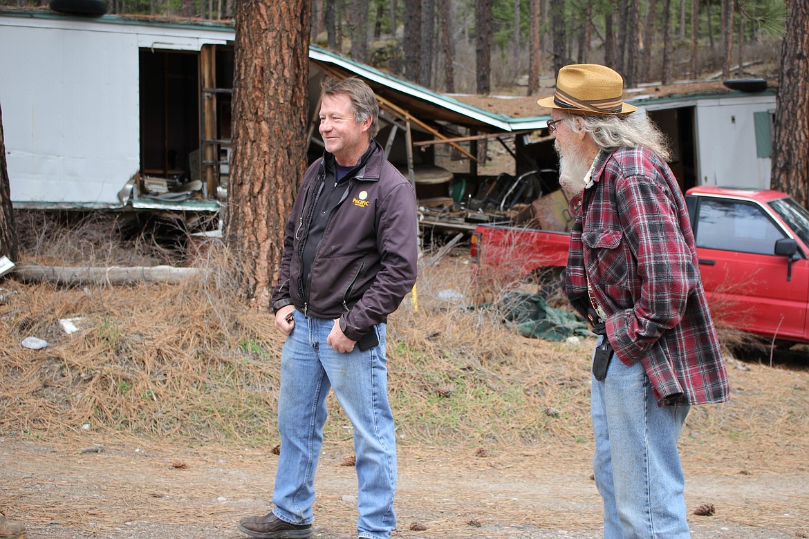 Dump land owner, Joe Hanson (right) works with Mason Mikkola (left) from Pacific Steel to remove around 50 junk vehicles and other scrap metal at the Alberton Town dump. (Kathleen Woodford/Mineral Independent).