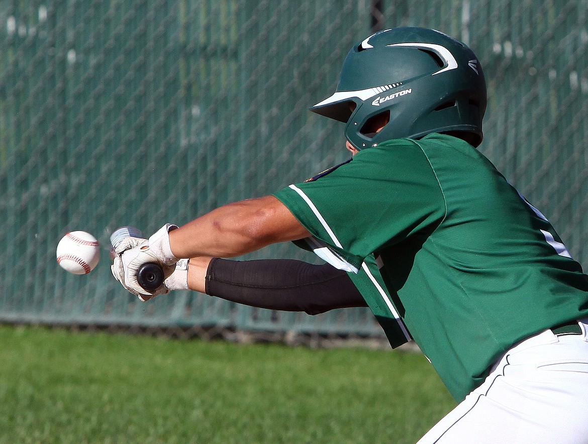 Rodney Harwood/Columbia Basin Herald
Moses Lake designated hitter Matt Vasquez (5) lays down a sacrifice bunt to move the runner during the first game of Tuesday&#146;s doubleheader at Larson Playfield. The Walleyes lost 4-3 to Hanford.