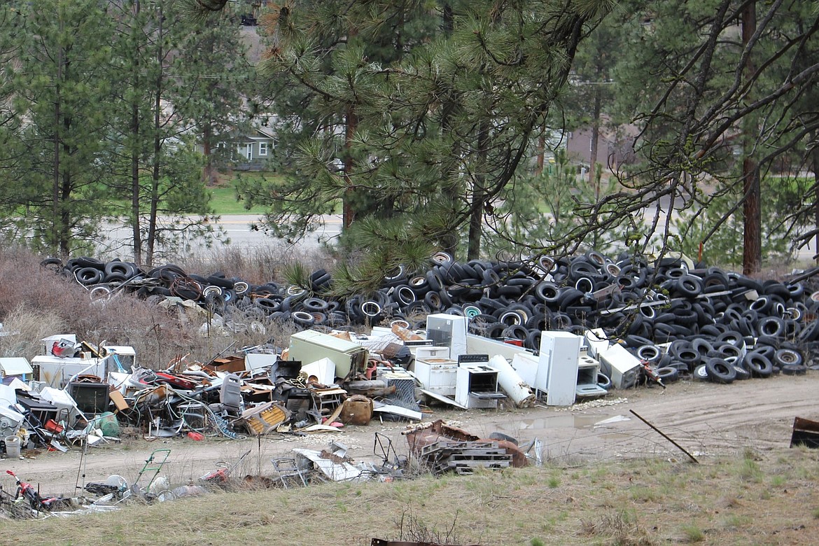 Rows of scrap metal and tires are piled high on Lee Shutters property which is adjacent to Joe Hansons&#146; 11-acre parcel. (Kathleen Woodford/Mineral Independent).