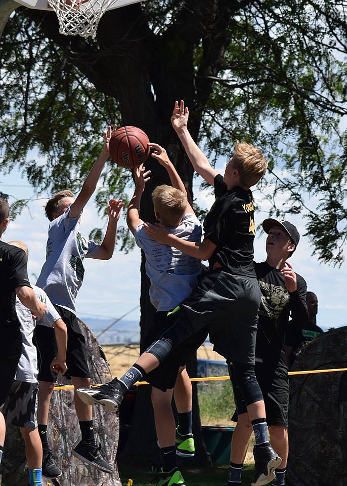 Courtesy photo - The 3-on-3 basketball tournament in the park during SummerFest can be intense. It helps raise funds for the Royal High School program.