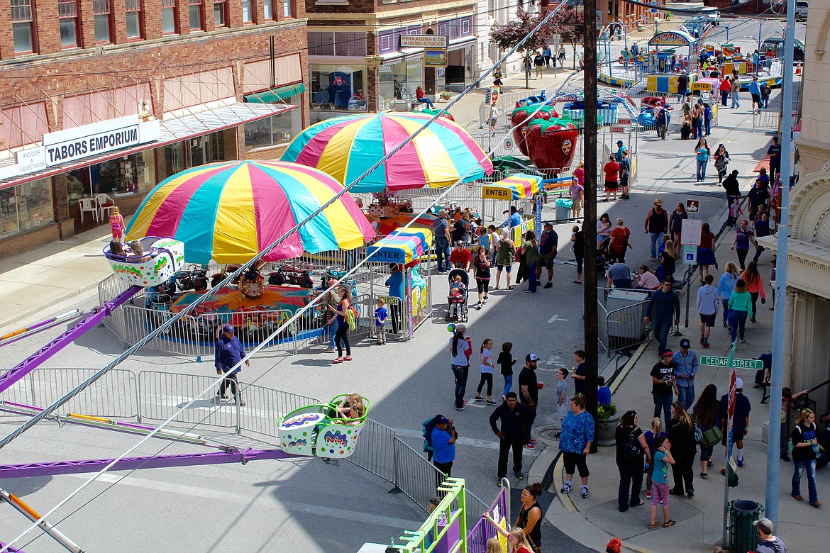 Attendees of Gyro Days enjoy the street fair set up on 6th and Cedar Street in Wallace.