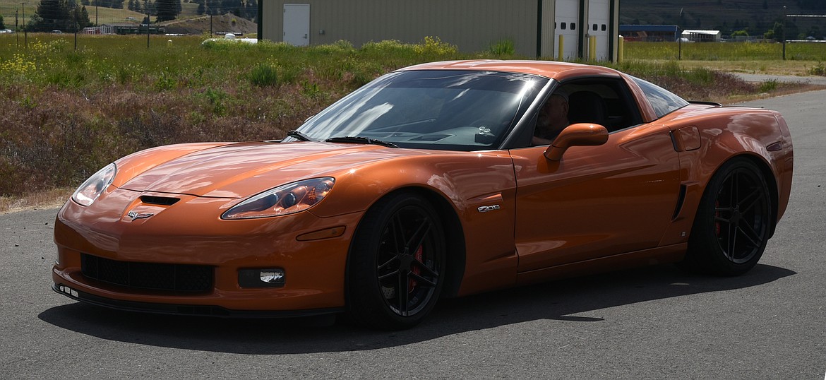 A gleaming orange Corvette at the Plains fly-in and car show. (Marla Hall/Clark Fork Valley Press)