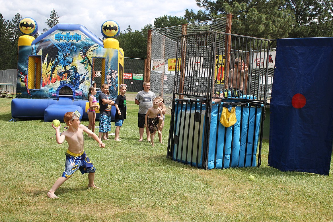 St. Regis baseball players took turns at the dunking booth during Saturdays party at the town park. (Kathleen Woodford/Mineral Independent)