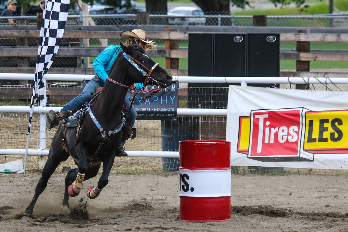 Photo by Mandi Bateman
Jenessa Hand calls for all the horsepower from Ryhs, to beat the motocycles.