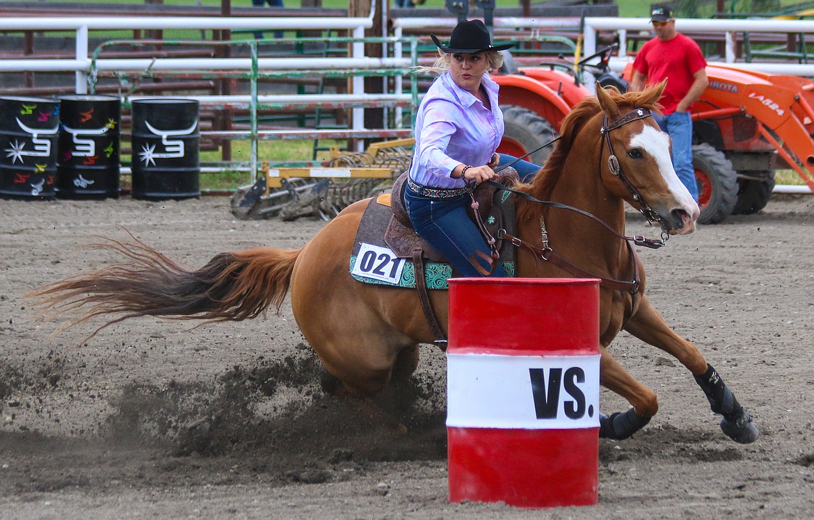 Courtney Crase tackles the third barrel during the first phase of Horsepower Collides!

Photos by Mandi Batemans