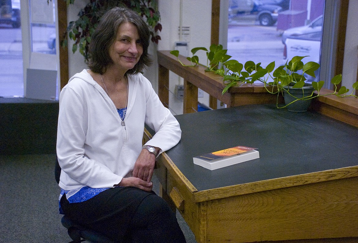 Author Milana Marsenich poses with her debut novel &#147;Copper Sky&#148; at the Lake County Leader office in Polson last week. (Brett Berntsen/Lake County Leader)