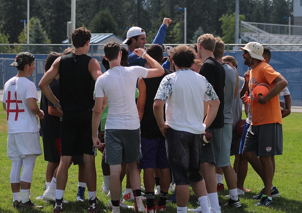 ERIC PLUMMER/Bonner County Daily Bee
NFL quarterback Brock Osweiler, center, and ex-NFL QB Jake Plummer, right, gather with high school athletes after a session with quarterbacks and receivers Friday at Coeur d'Alene High.