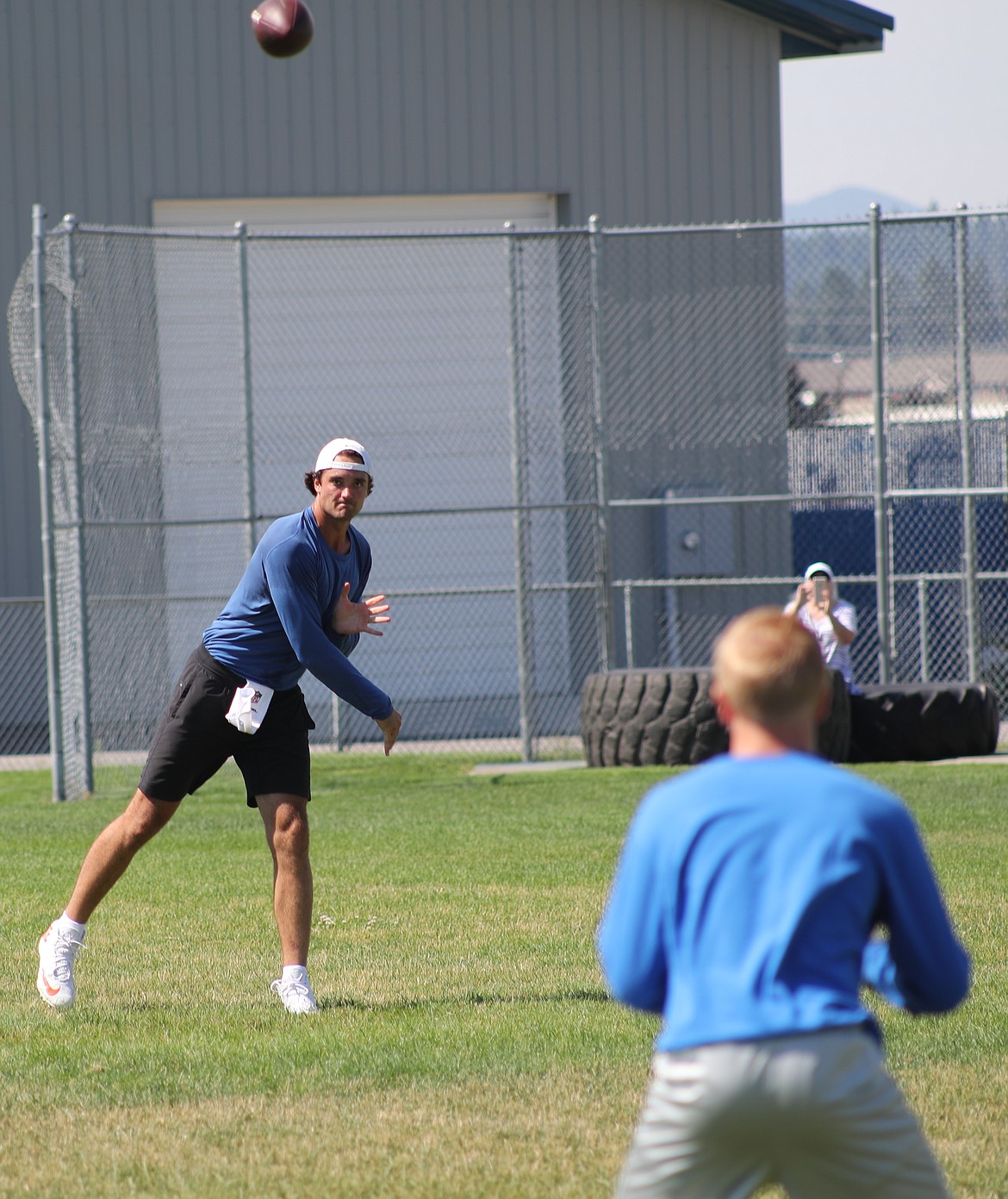 ERIC PLUMMER/Bonner County Daily Bee
Cleveland Browns quarterback Brock Osweiler throws to a high school receiver Friday at Coeur d'Alene High.