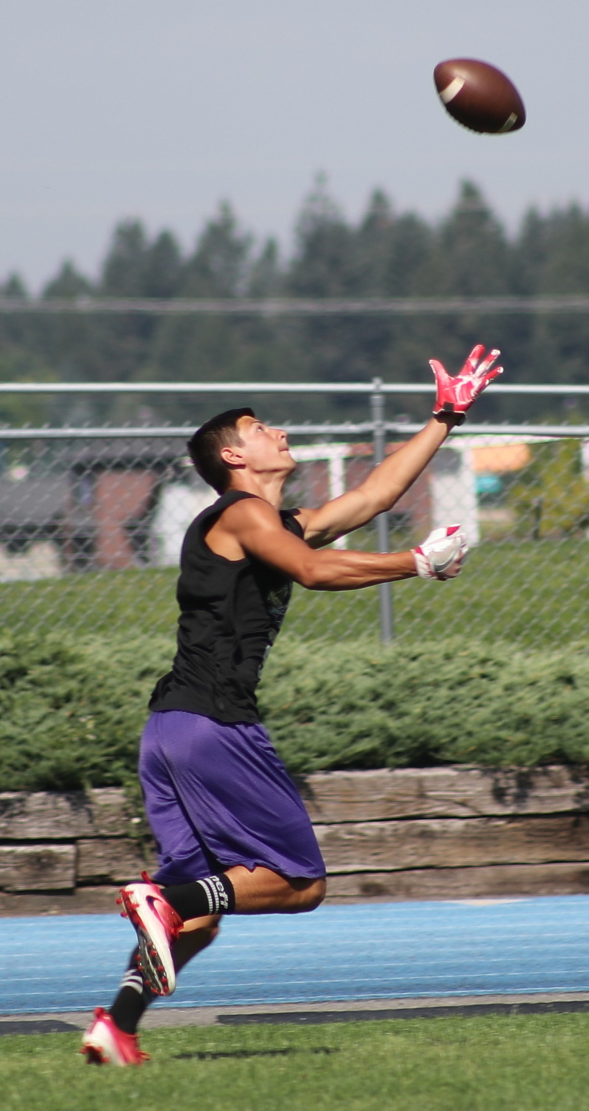 ERIC PLUMMER/Bonner County Daily Bee
Julian Barajas of Sandpoint High runs after a pass Friday at Coeur d'Alene High.