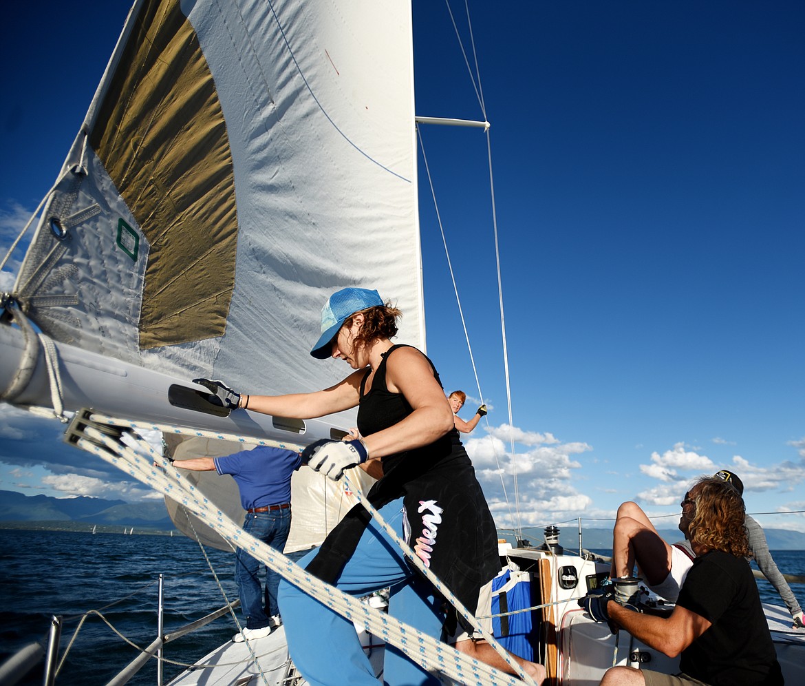 Brooke McMahon of Kalispell helps out as a crew member of Jim Kelley&#146;s boat Limerick on Tuesday, June 20, near Somers, in the Del&#146;s Tuesday Night Series.(Brenda Ahearn/Daily Inter Lake)