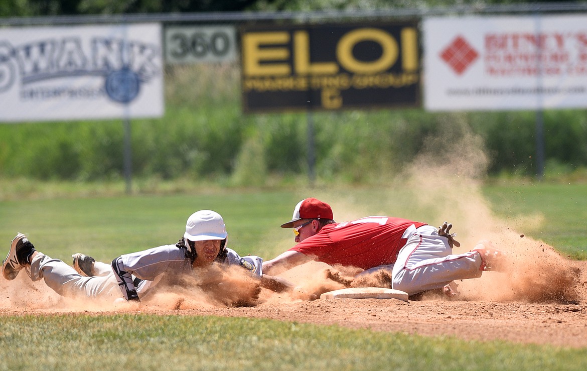 Kalispell Lakers A shortstop Taylor Morton attempts to tag a North Central Indian baserunner on a pick off at second base during the Lakers' opening game of the John R. Harp Baseball Tournament at Griffin Field on Friday. (Aaric Bryan/Daily Inter Lake)