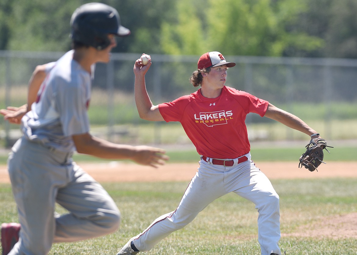 Kalispell Lakers A pitcher Cole Crosby throws to first after fielding a grounder against the North Central Indians on Friday. (Aaric Bryan/Daily Inter Lake)