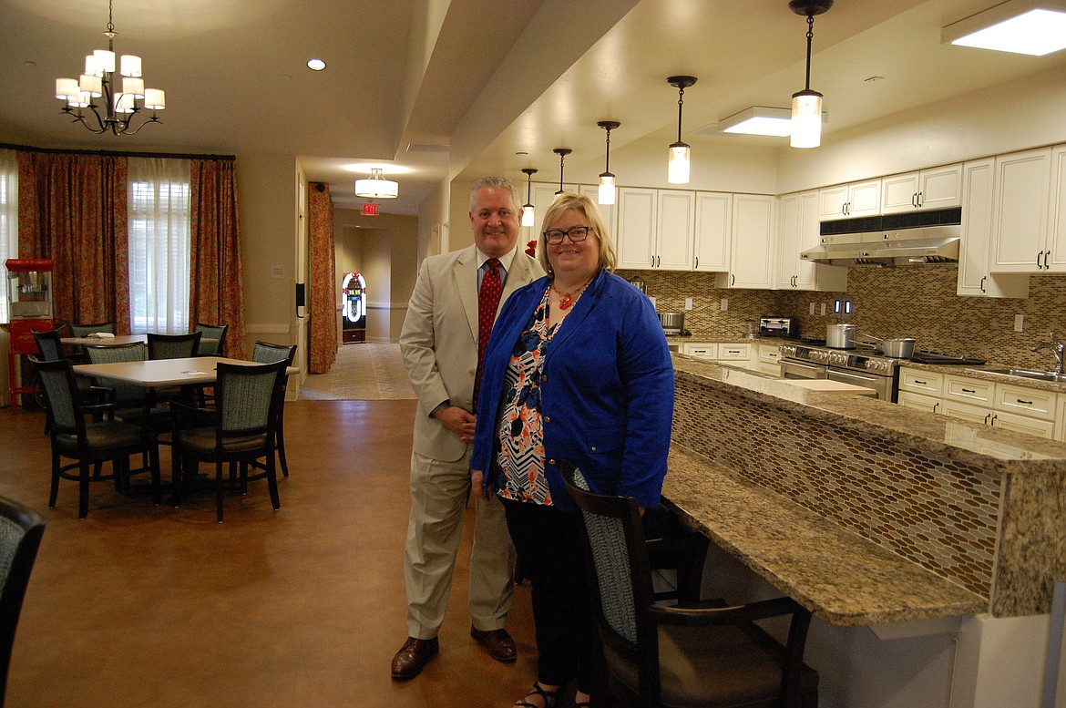 Jason Cronk and Carla Wilton with Immanuel Lutheran Communities stand in the new assisted-living memory-support community, The Lodge at Buffalo Hill. Wilton said details of the program&#146;s space, such as its open kitchen plan, were designed to create a place of peace for residents living with dementia. (Photo by Katheryn Houghton/Daily Inter Lake)