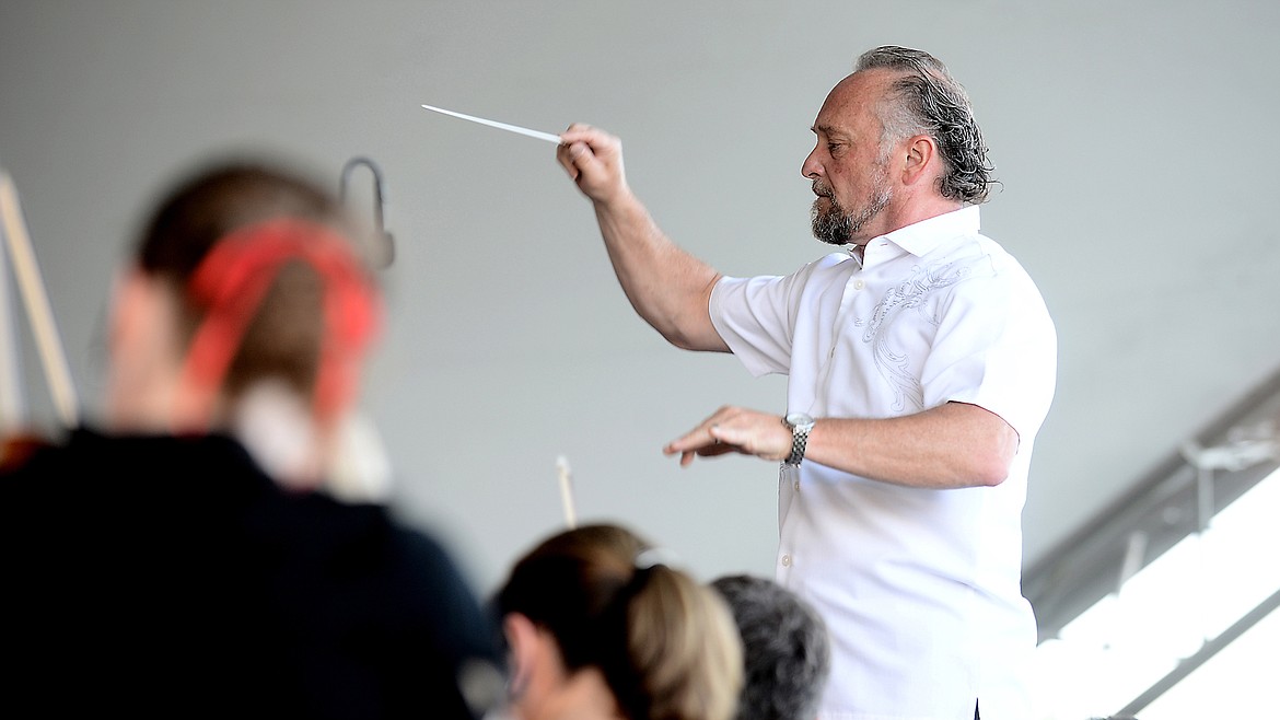 MAESTRO JOHN Zoltek conducting the Glacier Symphony at a 2013 summer pops concert.