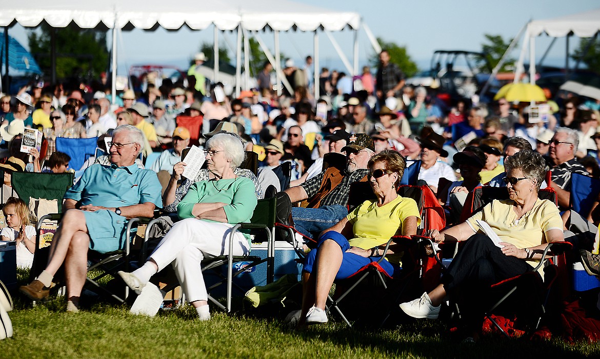 A LARGE audience at Rebecca Farm watches a summer pops concert from the Glacier Symphony.