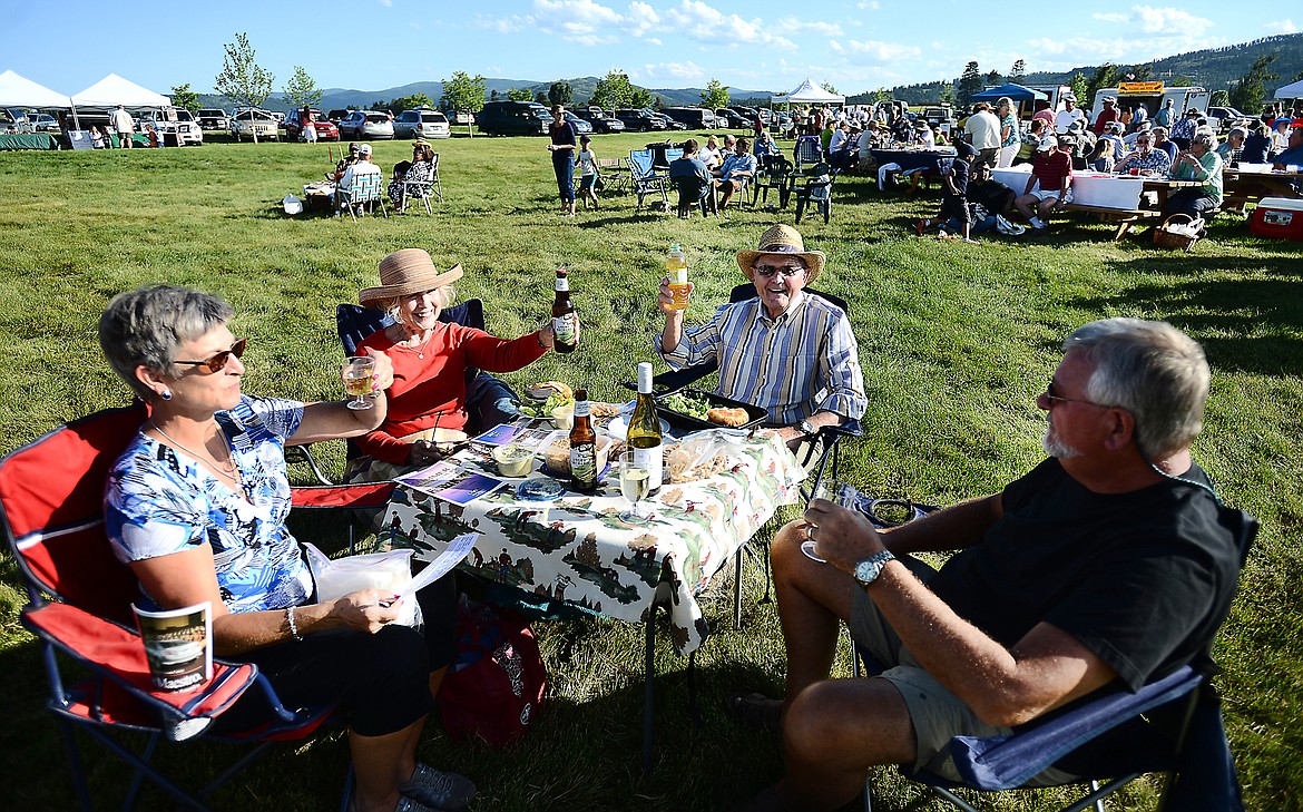 GUESTS AT a 2016 summer pops concert enjoy a picnic meal &#151; and a few beverages &#151; during the show. (Brenda Ahearn photos/This Week in the Flathead, file)