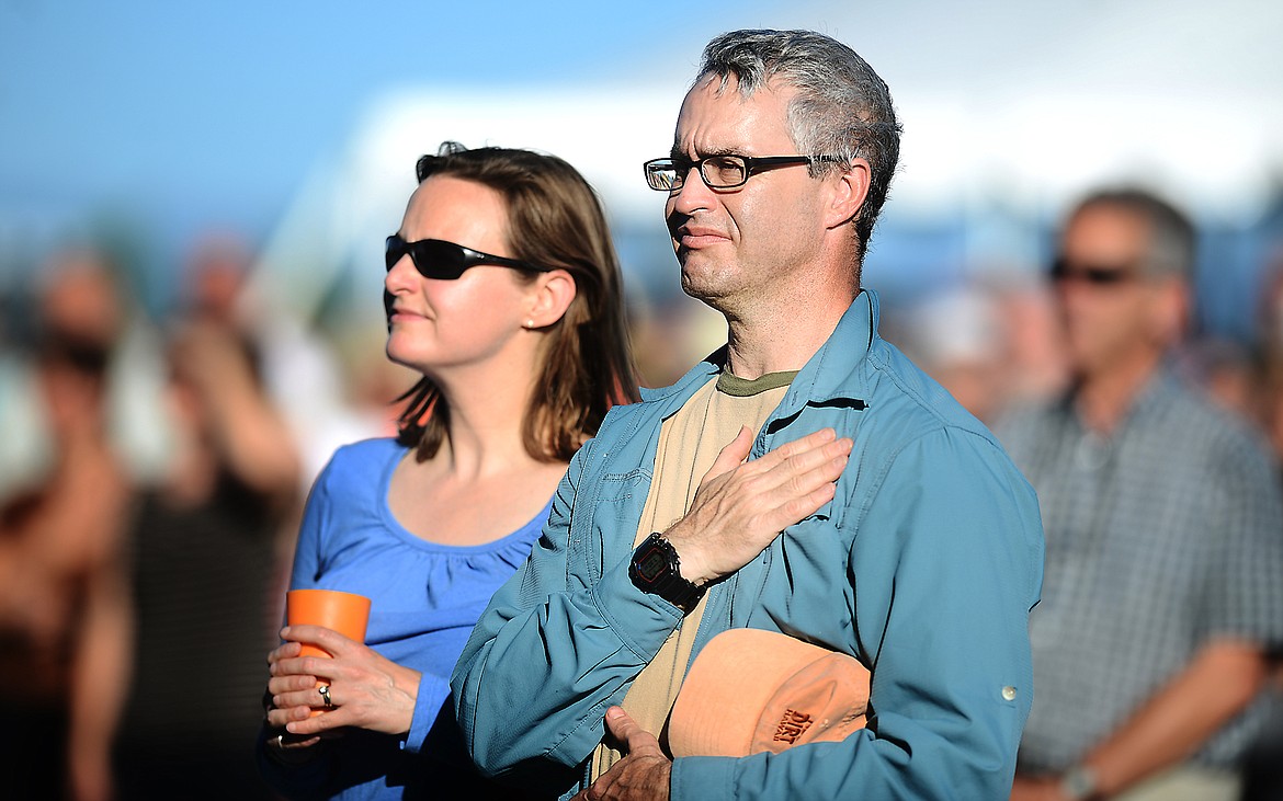 A COUPLE takes in a summer pops concert.