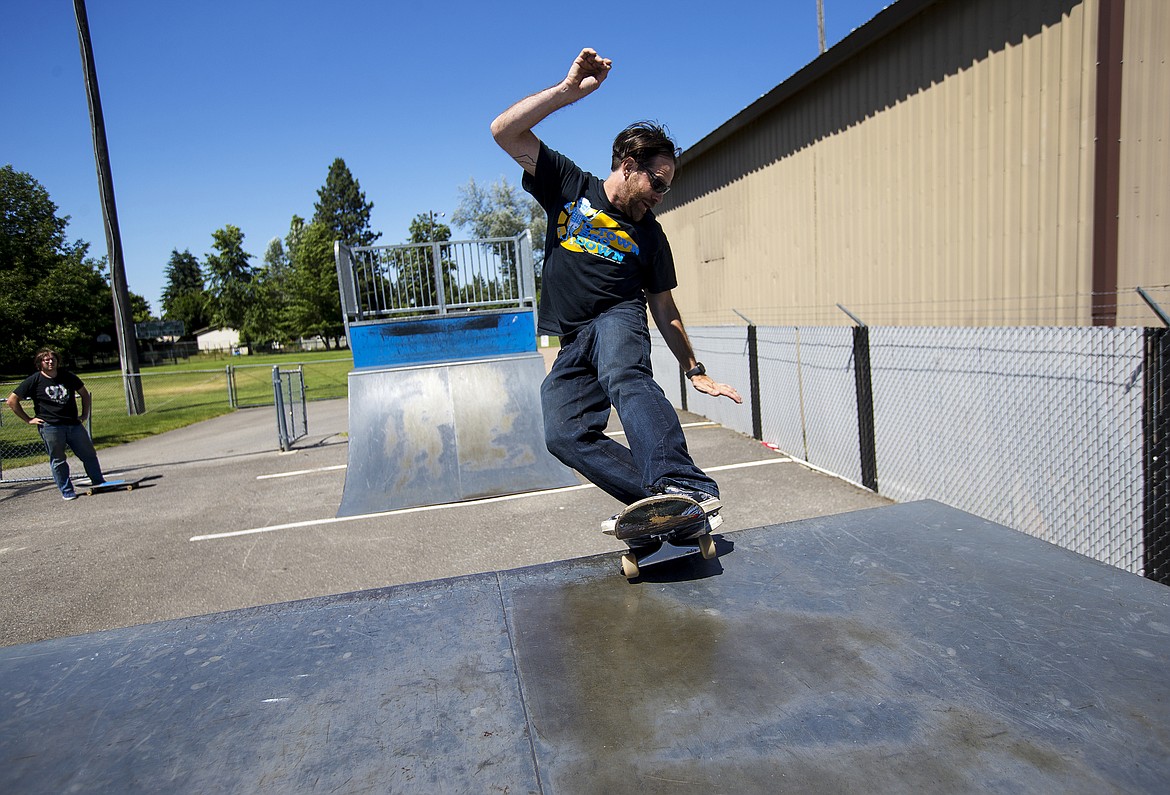 Photos: LOREN BENOIT/Press
Nathan &#145;Ope&#146; Baker practices his frontside rock trick Monday afternoon at the city of Coeur d&#146;Alene&#146;s temporary skatepark at 1355 Best Ave.