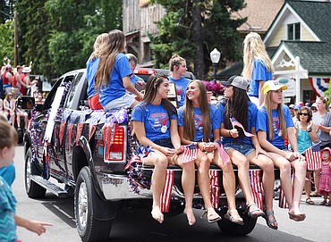 The Bigfork Girls State Track Champions riding through the Bigfork Fourth of July Parade on Tuesday afternoon, July 4. (Brenda Ahearn/Daily Inter Lake)