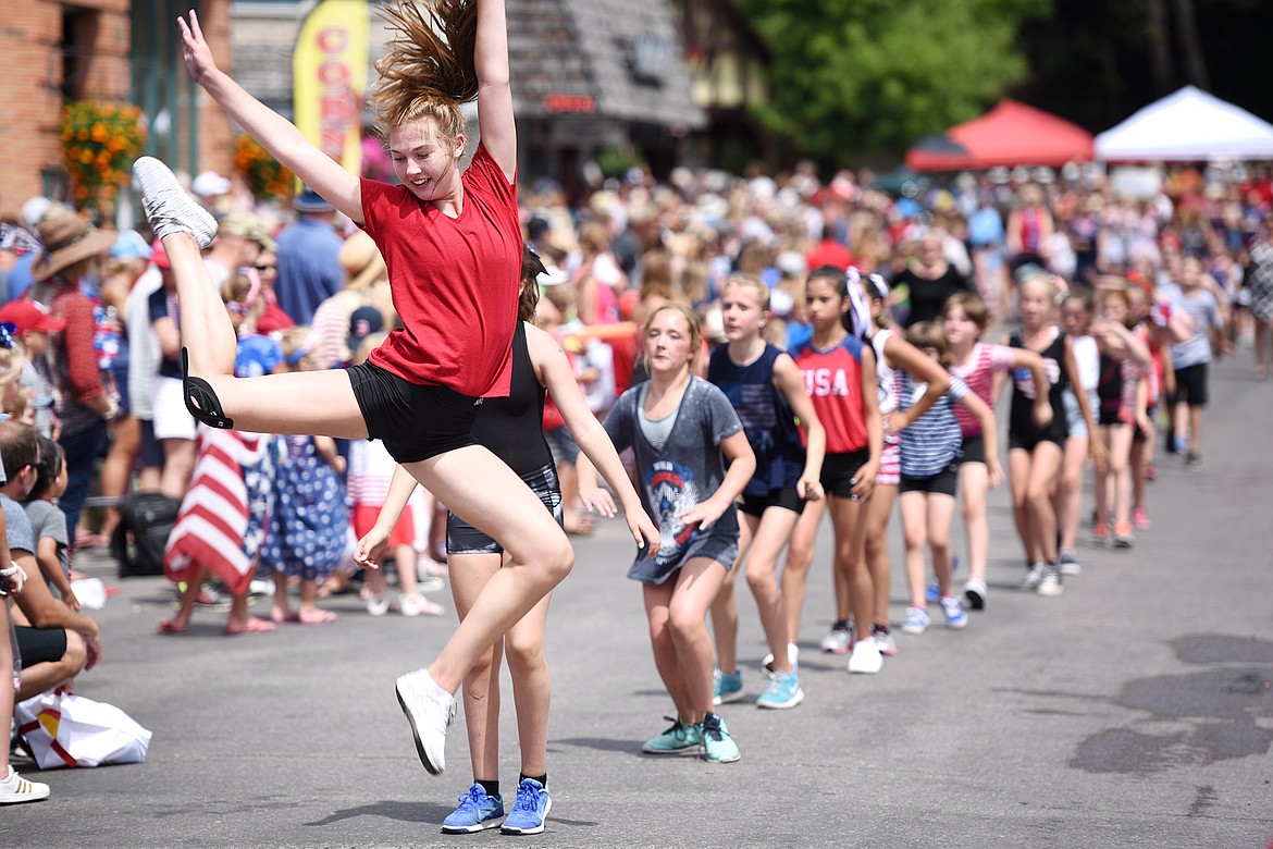 Performers from the Bigfork and Whitefish Dance and Acrobat Studios join forces for the Bigfork Fourth of July Parade on Tuesday afternoon, July 4. (Brenda Ahearn/Daily Inter Lake)