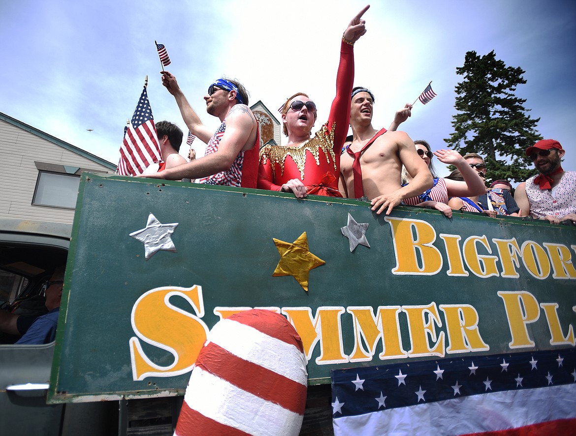 The Bigfork Summer Playhouse performers sing the National Anthem as they ride down Electric Avenue at the Bigfork Fourth of July Parade on Tuesday afternoon, July 4. (Brenda Ahearn/Daily Inter Lake)