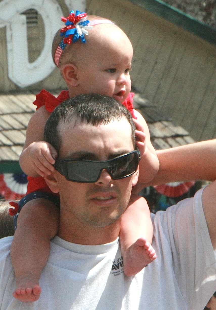 BRIAN WALKER/Press
Cayle Stevens of Bayview gives his 7-month-old daughter Daphne a view of the Bayview Daze parade on Saturday.