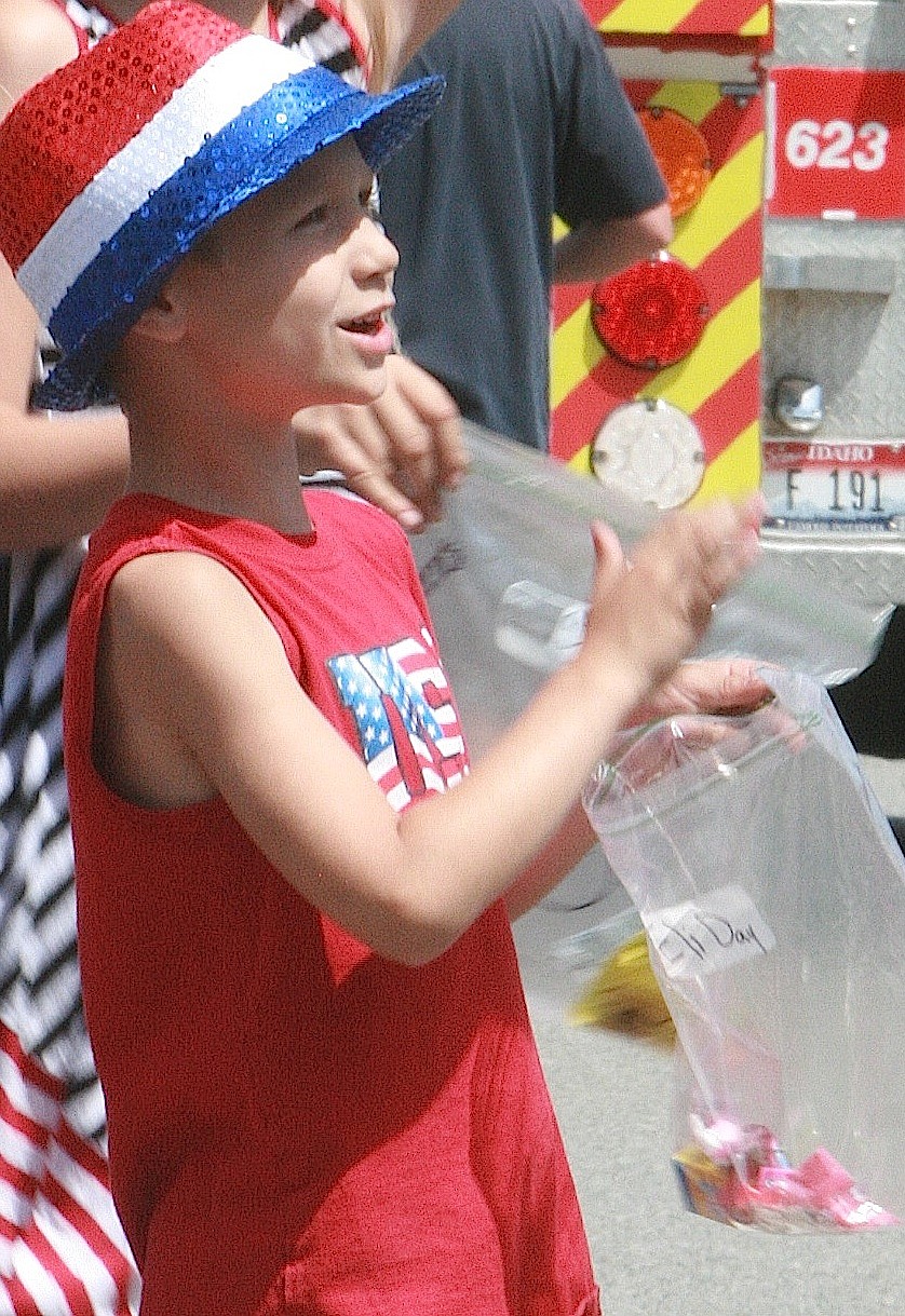 BRIAN WALKER/Press
Eli Day, 6, cheers on the Bayview Daze parade participants on Saturday.