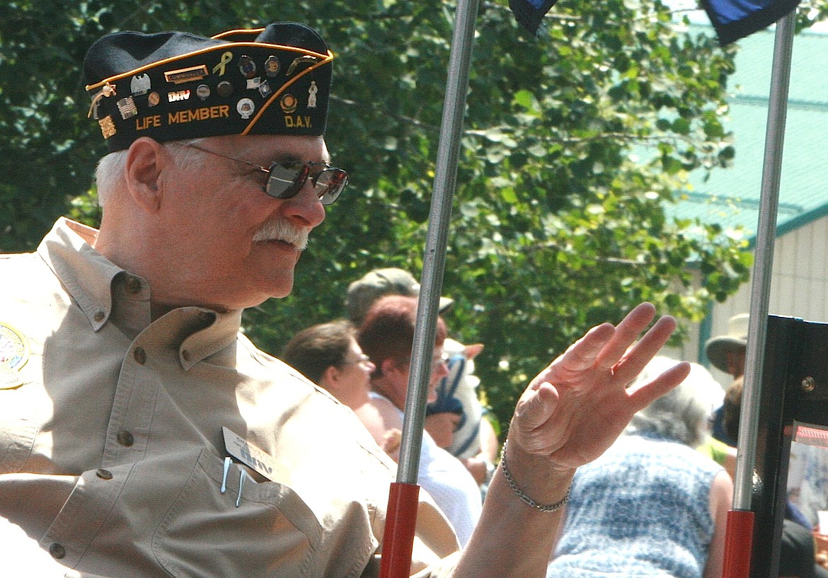 BRIAN WALKER/Press
Charlie Till waves to the Bayview Daze parade crowd on Saturday from the Disabled American Veterans float.